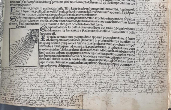 Photo of page of Chetham's Library's copy of the Nuremberg Chronicle with printed text concerning prodigies, and manuscript notes from the owner concerning a personal vision of Jesus