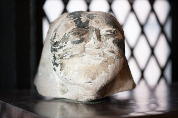 Stone head sitting on a desk