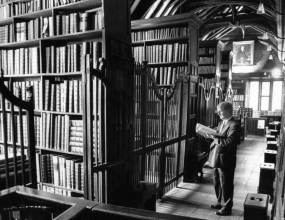 Photograph of Librarian Michael Powell in the Library, 1995