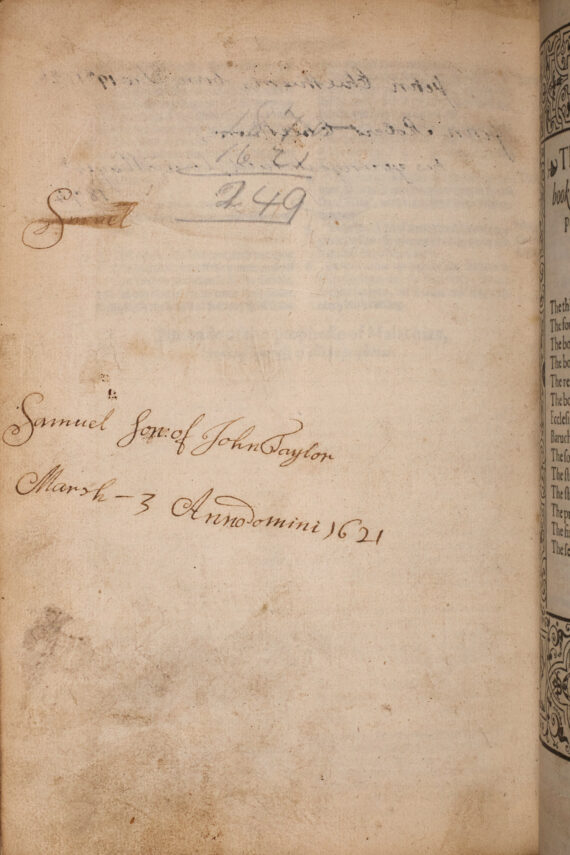 A blank page of a book, on which the handwritten addition ‘Samuel son of John Taylor, March 3 Anno domini 1621’ has been written. Above this, a sum calculating the number of years between 1870 and 1621 has been written in pencil. 