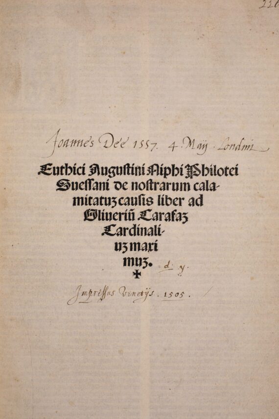 The title page of John Dee’s copy of Agostino Nifo’s Euthici Augustini. The title is printed in a gothic type in lines of decreasing length to form an inverted triangle shape, with a cross at the bottom. Above the title, the words ‘Joannes Dee 1557. 4. Maii. Londini’ have been written in a calligraphic hand in ink.
