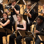 Members of the Big Band performing, with flute, saxophone and trombone