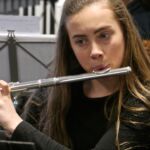 Tameside Music Service, featuring a young musician playing the flute