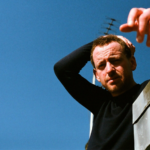 Stephen Fretwell against a blue background