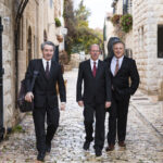 Trio Shaham Erez Wallfisch, standing on a cobbled strret