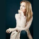 Folk singer Cara Dillon against a dark green background