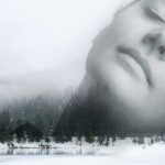 Black and white photo of a woman's face superimposed on a forest landscape