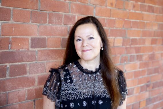 Pianist Kathryn Stott with a brick wall background