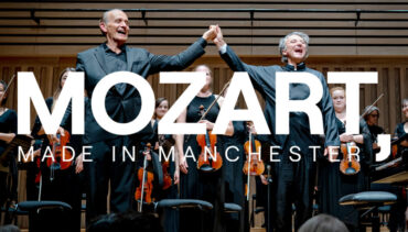 Image of Manchester camerata performing with white overlaid text which reads: MOZART MADE IN MANCHESTER