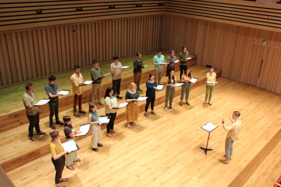 Members of Kantos Choir performing on stage