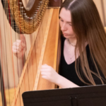 Girl playing the harp