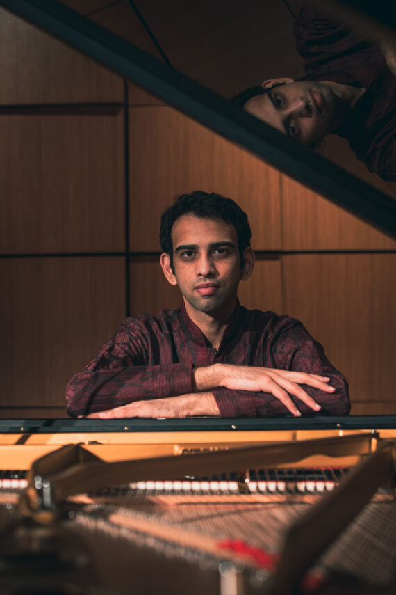 Musician Utsav Lal sits at the piano