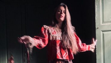 artist Olivia Chaney in a red jacket
