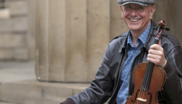 Musician Tom McConville with violin