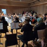 Young musicians from Tameside music service performing on the Stoller Hall stage