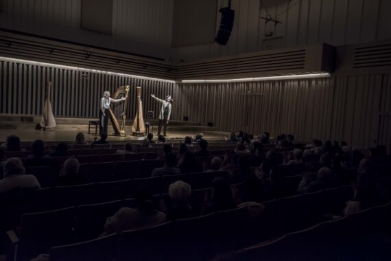 Two harpists on stage