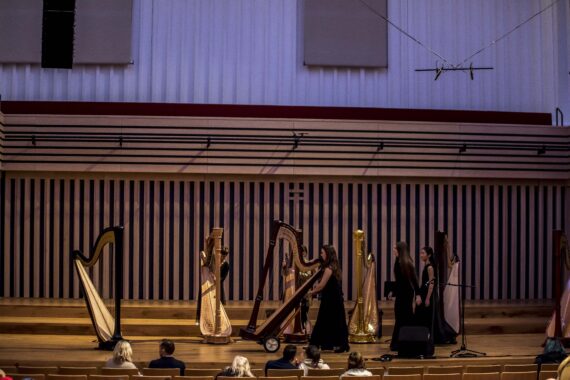 A row of harps on The Stoller Hall stage