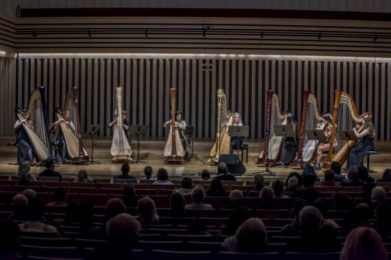A full ensemble of harps performing in our Friday night Opening recital
