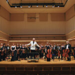 Manchester Beethoven orchestra performing on the Stoller Hall stage