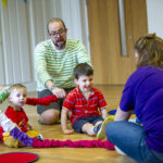 Children and adults playing