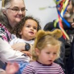 Children and adults watching an interactive session