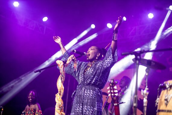 Musician Kasiva Matua singing on stage