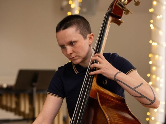 Musician Nina Harries playing the double bass