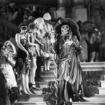 Black and white image from the film Phantom of the Opera showing a figure in a skull mask