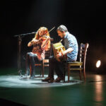Violinist and accordionist performing