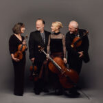 Four members of the Brodsky String Quartet with instruments