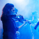 A women with a violin on a blue background