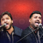 Two men with microphones on a red background