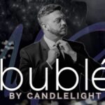 Black and white image of a man in a suit. Text reads Bublé By Candlelight