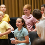 a group of children in school uniforms