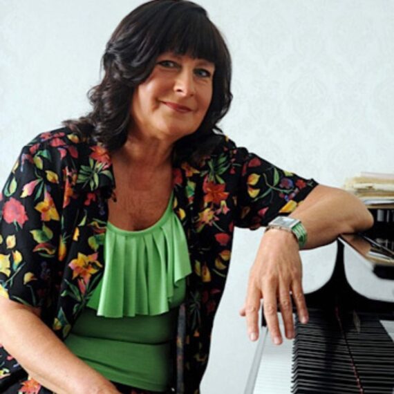 pianist Alicja Fiderkiewicz sits at piano