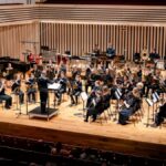Photo of the National Youth Concert Band performing on the Stoller Hall stage