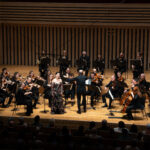 Manchester Camerata performing on stage with soloist Ying Fang