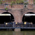 Members of Kantos Chamber Choir standing on a bridge
